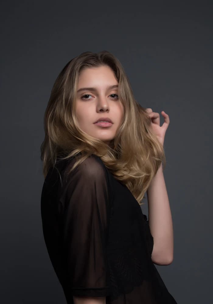 Female editorial model portrait in warm light