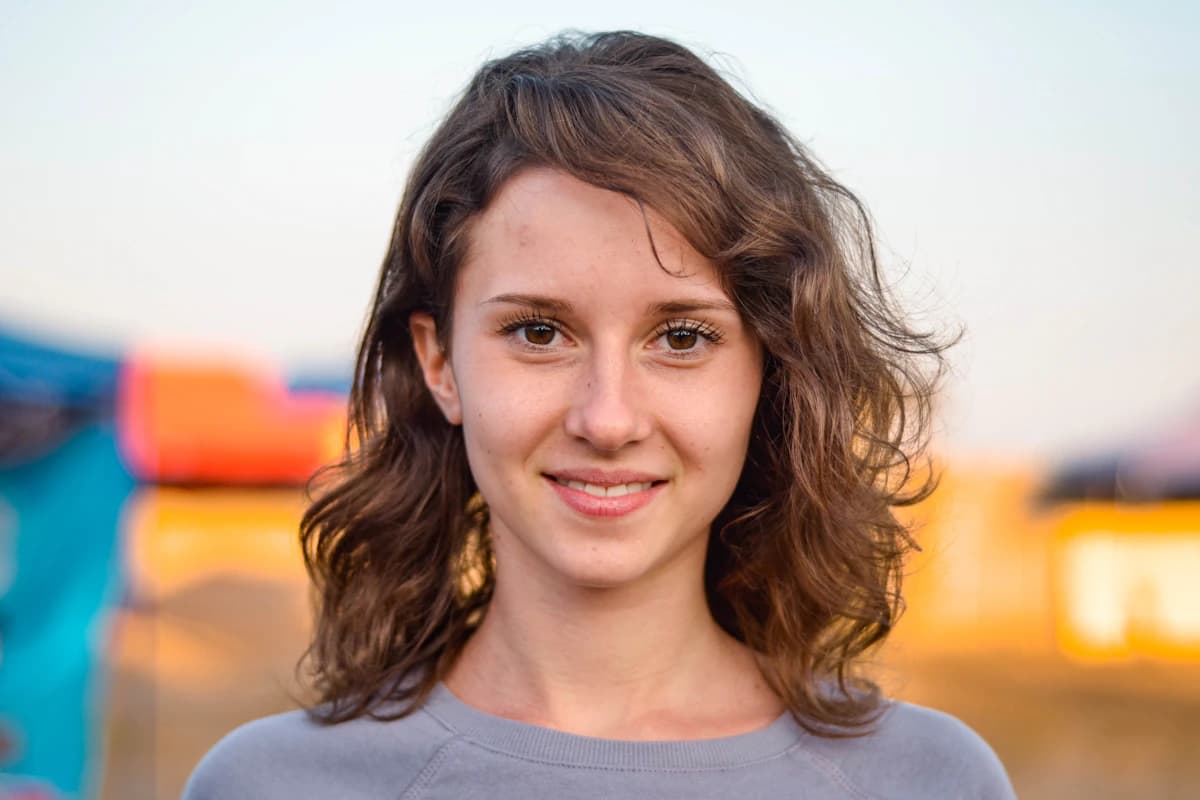 Straight-on portrait in even light showing the facial thirds and feature spacing that determine facial harmony