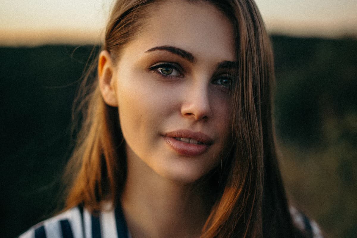 Front-facing female portrait with balanced facial proportions used to illustrate a face symmetry and golden ratio test