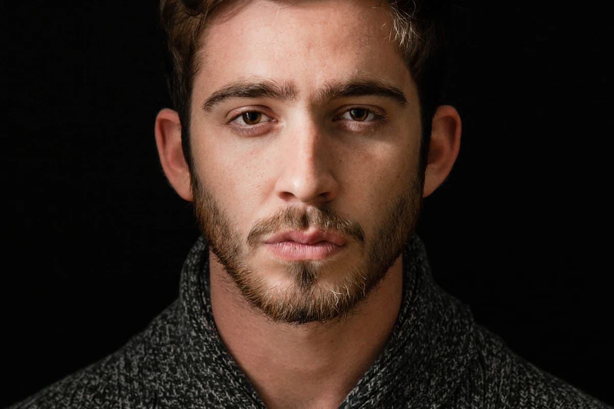 Male model with defined jawline and bone structure — the facial features modeling agencies look for in new faces