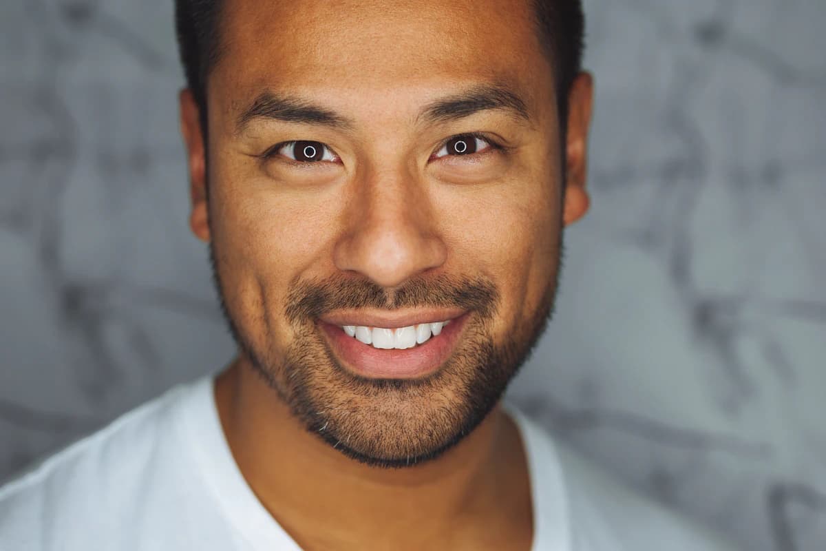 Natural unedited male portrait in plain clothing and soft window light, the style modeling agencies want in digitals